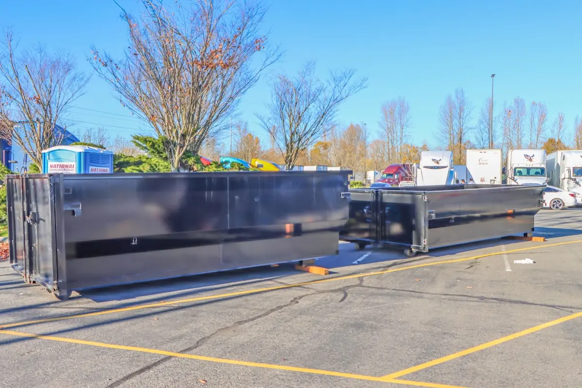 Professional dumpster rental service with roll-off container on residential driveway in Cathedral City